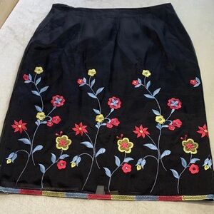 Clio VGC silk skirt knee length black embroidered red, blue, yellow flowers sz10